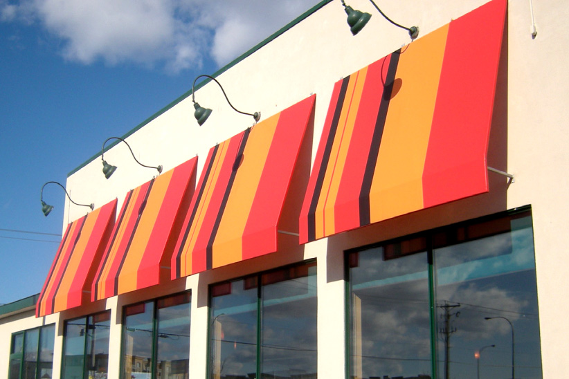 Picture showing a red, orange and purple awning over a building window in Ottawa