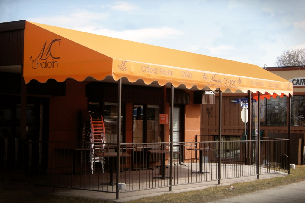 Picture showing an orange awning over a building porch in Ottawa